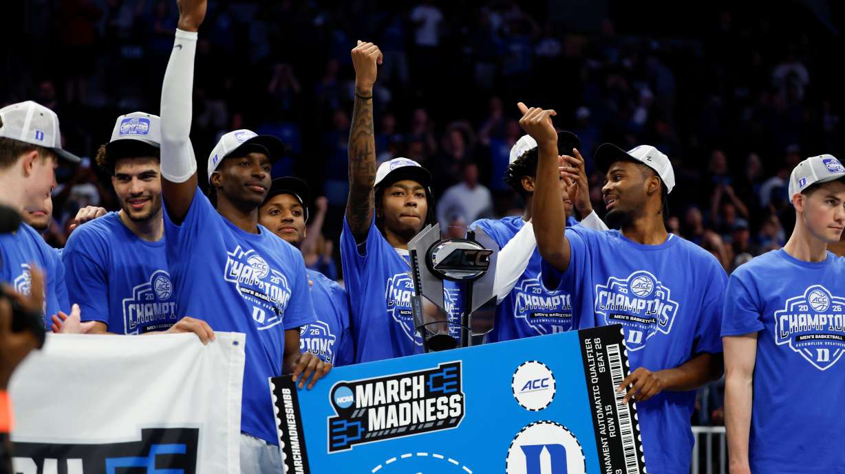 Duke celebrates winning the championship of the Atlantic Coast Conference tournament in an NCAA college basketball game in Charlotte, N.C., Saturday, March 14, 2026.