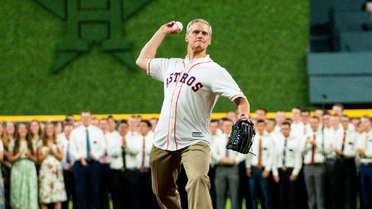 Elder David A. Bednar of the Quorum of the Twelve Apostles throws out the ceremonial first pitch prior to a Houston Astros game on July 22, 2019, in Houston, Texas. Another David Bednar is pitching for Team USA in the World Baseball Classic.