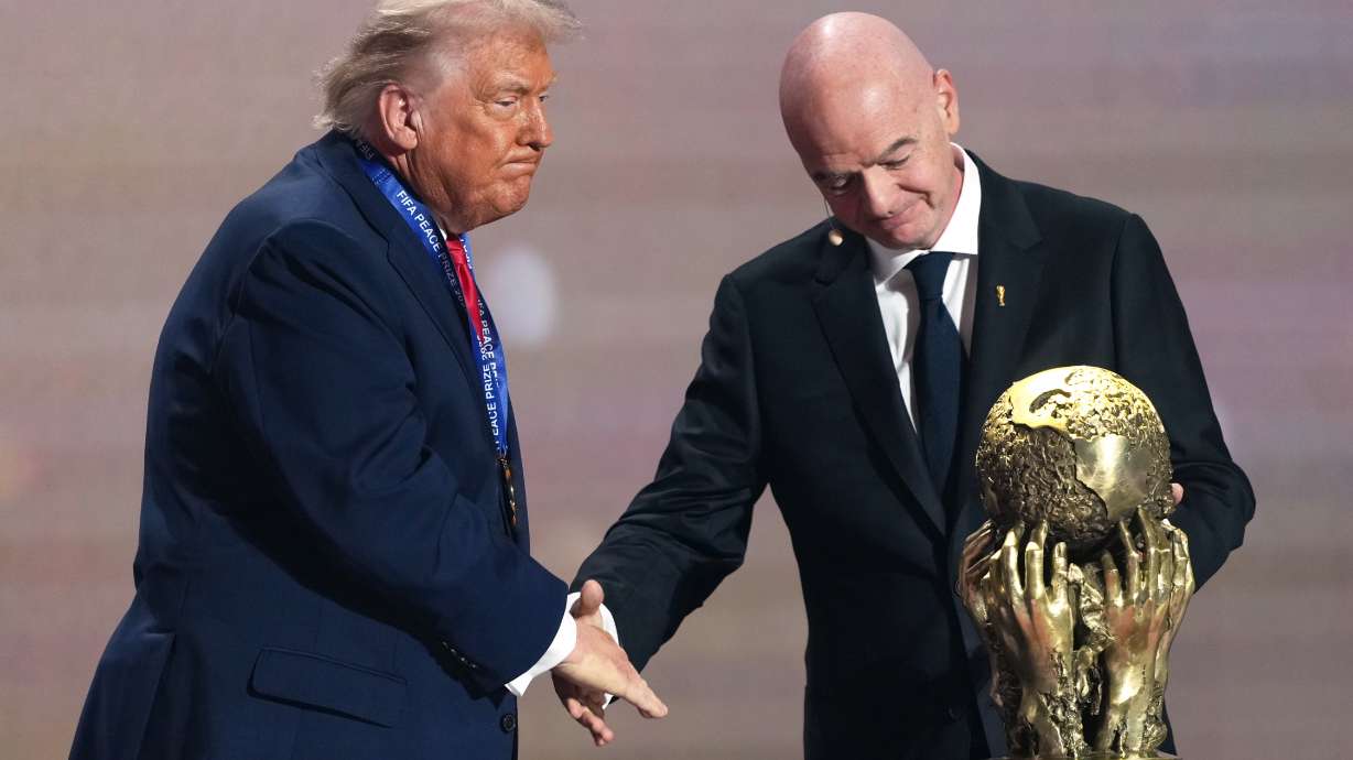 FILE - FIFA President Gianni Infantino presents President Donald Trump with the FIFA Peace Prize during the draw for the 2026 soccer World Cup at the Kennedy Center in Washington, Friday, Dec. 5, 2025. (AP Photo/Stephanie Scarbrough, Pool, File_