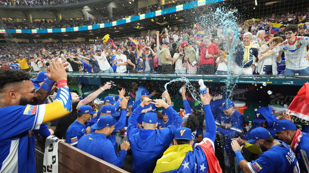 The Venezuela team celebrates after defeating Italy at a World Baseball Classic semifinal game, Monday, March 16, 2026, in Miami.