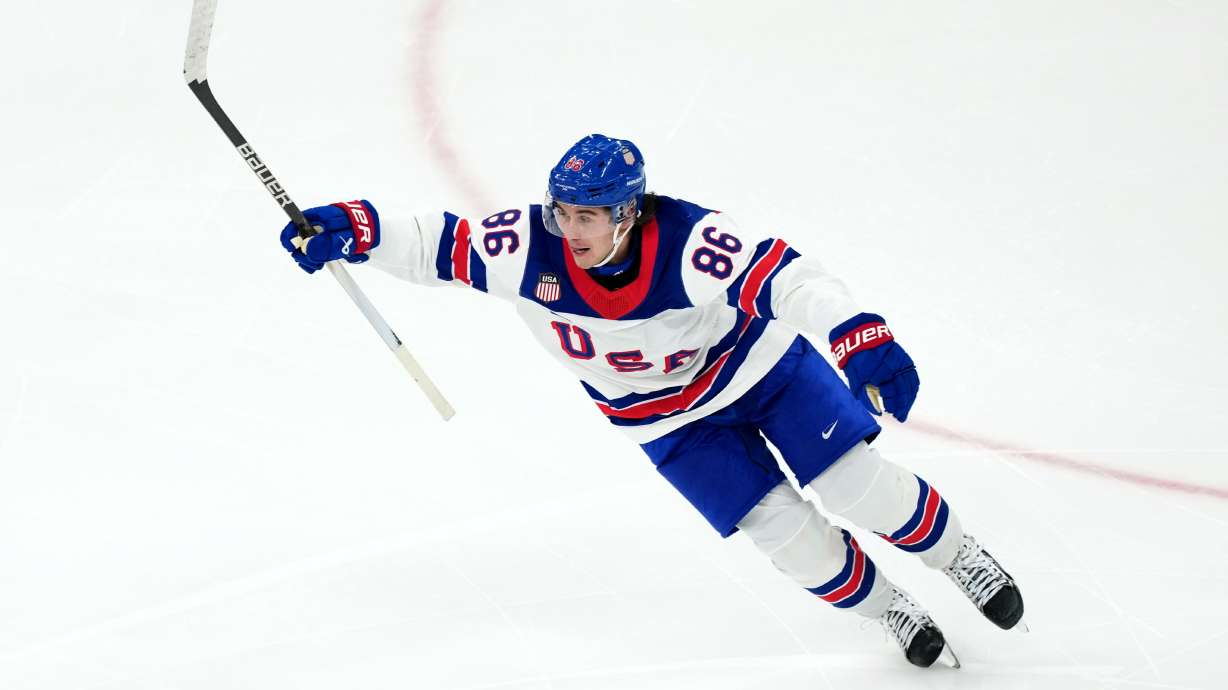 United States' Jack Hughes celebrates after scoring the winning goal against Canada during the overtime period of the men's ice hockey gold medal game at the 2026 Winter Olympics in Milan, Italy, Sunday, Feb. 22, 2026.