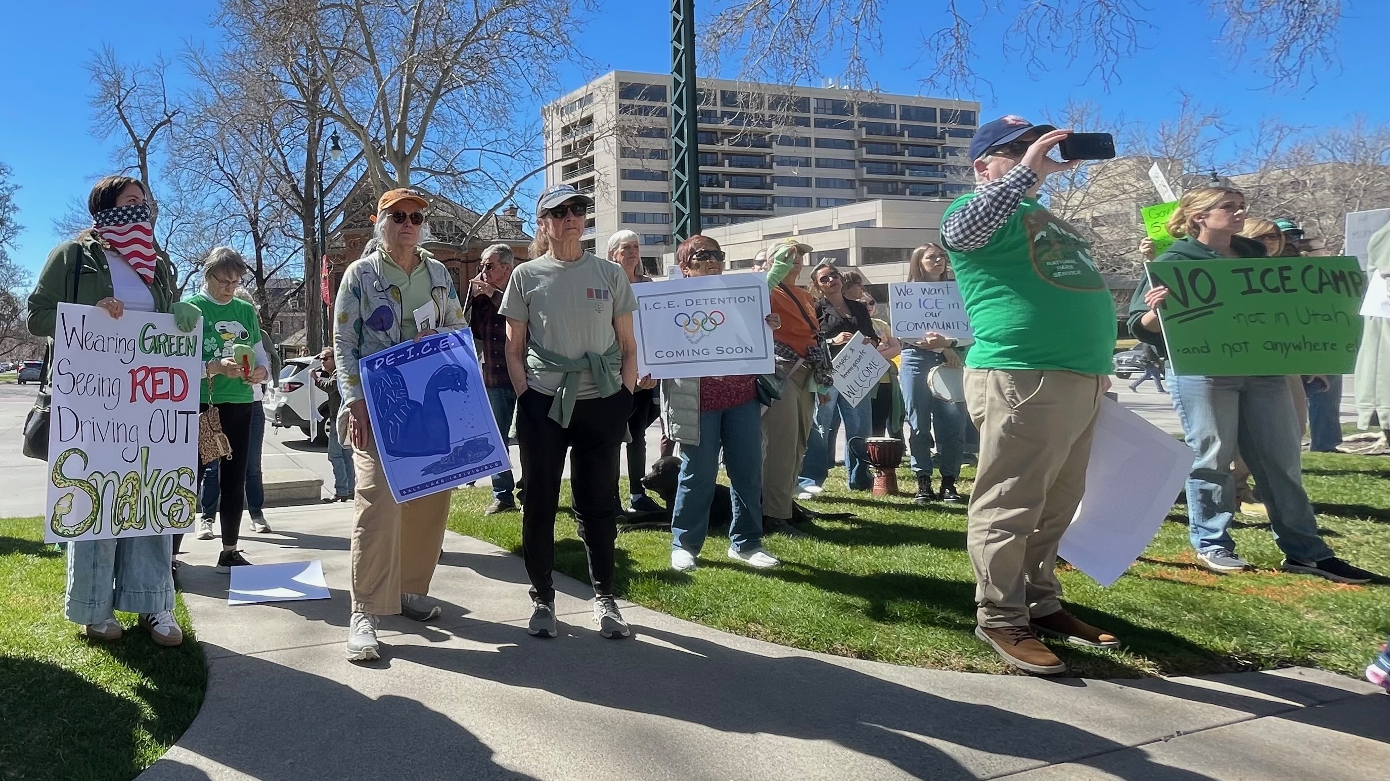 About 100 demonstrators gathered outside the mansion of Gov. Spencer Cox in Salt Lake City on Tuesday to protest plans to build an immigrant detention facility in the city.
