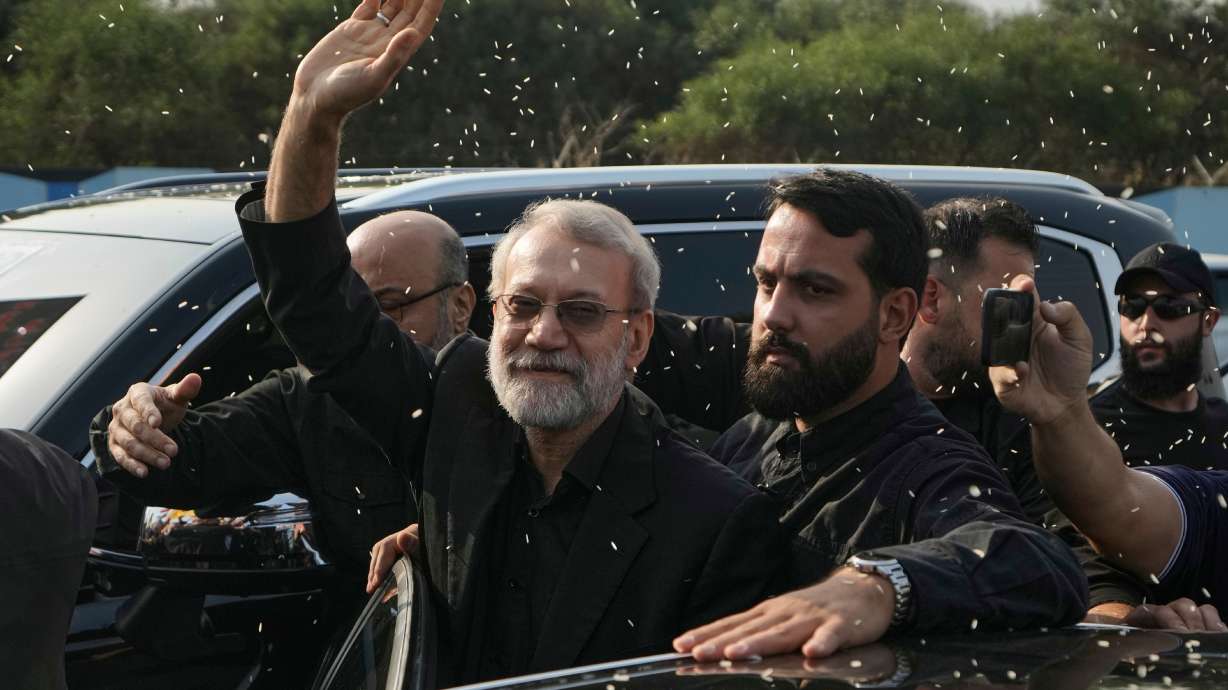 Ali Larijani, center, head of Iran's National Security Council, gestures as Hezbollah supporters throw rice to welcome him outside Rafik Hariri International Airport in Beirut, Aug. 13, 2025. Israeli Defense Minister Israel Katz said Iranian Intelligence Minister Esmail Khatib had been killed in an overnight strike.