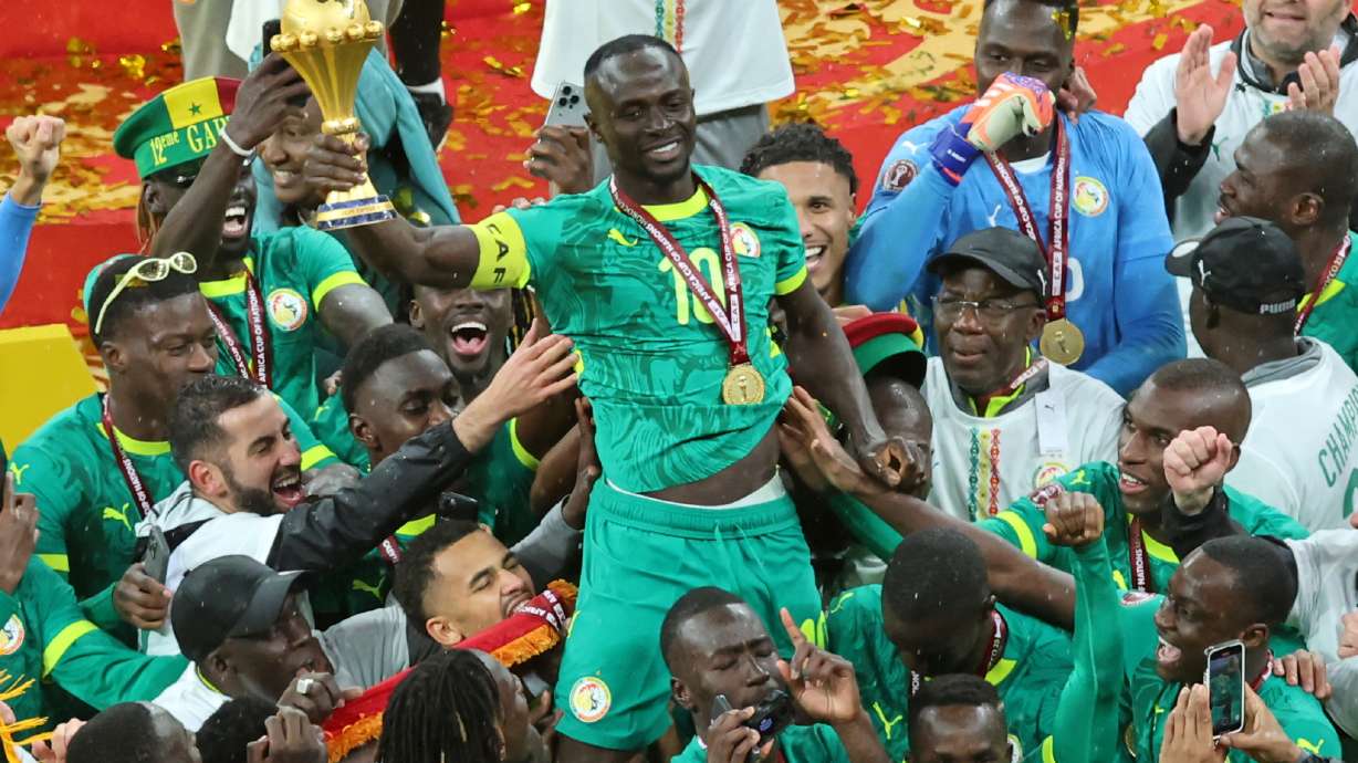 FILE - Senegal's Sadio Mane holds the trophy aloft as he celebrates with teammates after winning the Africa Cup of Nations final soccer match between Senegal and Morocco in Rabat, Morocco, Sunday, Jan. 18, 2026.