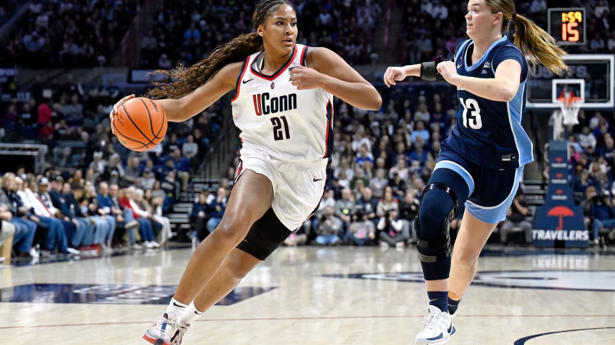 FILE - UConn forward Sarah Strong (21) is guarded by Villanova forward Brynn McCurry (13) in the first half of an NCAA college basketball game, Thursday, Jan. 15, 2026, in Storrs, Conn.