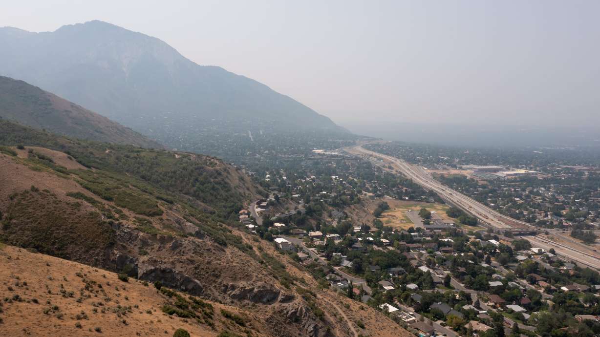 Smoky skies seen from the base of Grandeur Peak in Millcreek on July 26, 2021. As suicide rates have been climbing for several decades, recognizing the impact of heat stress and air pollution could prove helpful for policymakers and others.