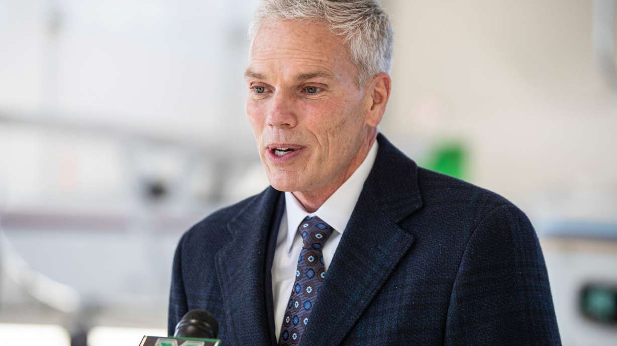 FILE - Marshall University President Brad Smith speaks with members of the media, Jan. 26, 2022, at the Huntington Tri-State Airport, in Huntington, W.Va.