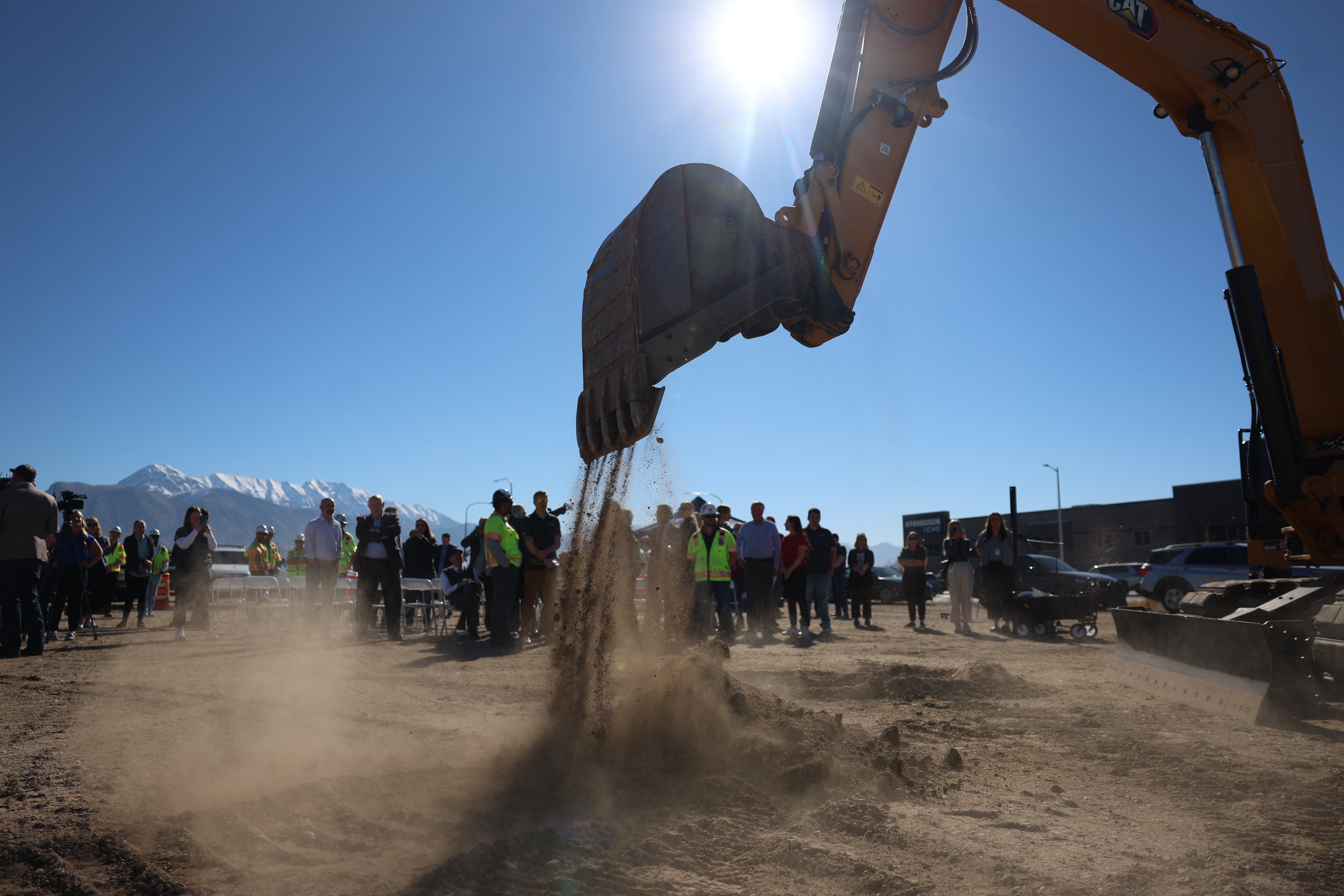 Utah Department of Transportation officials along with city, county and state leaders break ground for the 2100 North freeway project in Lehi on Wednesday.