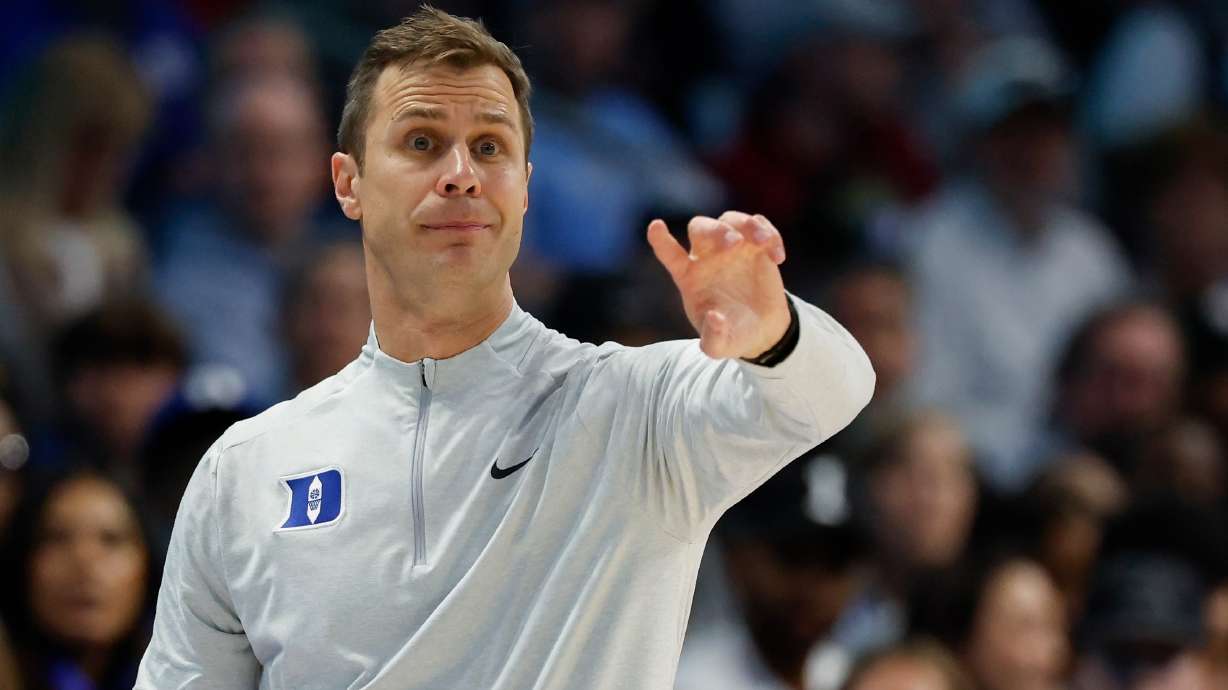 Duke head coach Jon Scheyer directs his team against Florida State during the second half of an NCAA college basketball game in the quarterfinals of the Atlantic Coast Conference tournament in Charlotte, N.C., Thursday, March 12, 2026.