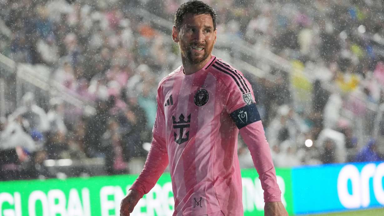 Inter Miami forward Lionel Messi (10) walks to kick a corner kick in heavy rain during the first half of a CONCACAF Champions Cup Round of 16 soccer match against Nashville, Wednesday, March 18, 2026, in Fort Lauderdale, Fla.