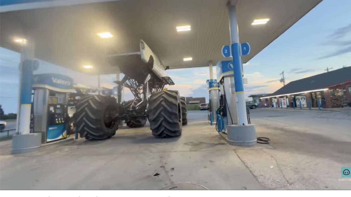 This truck looks like it's only a few inches away from tearing the gas station canopy down.