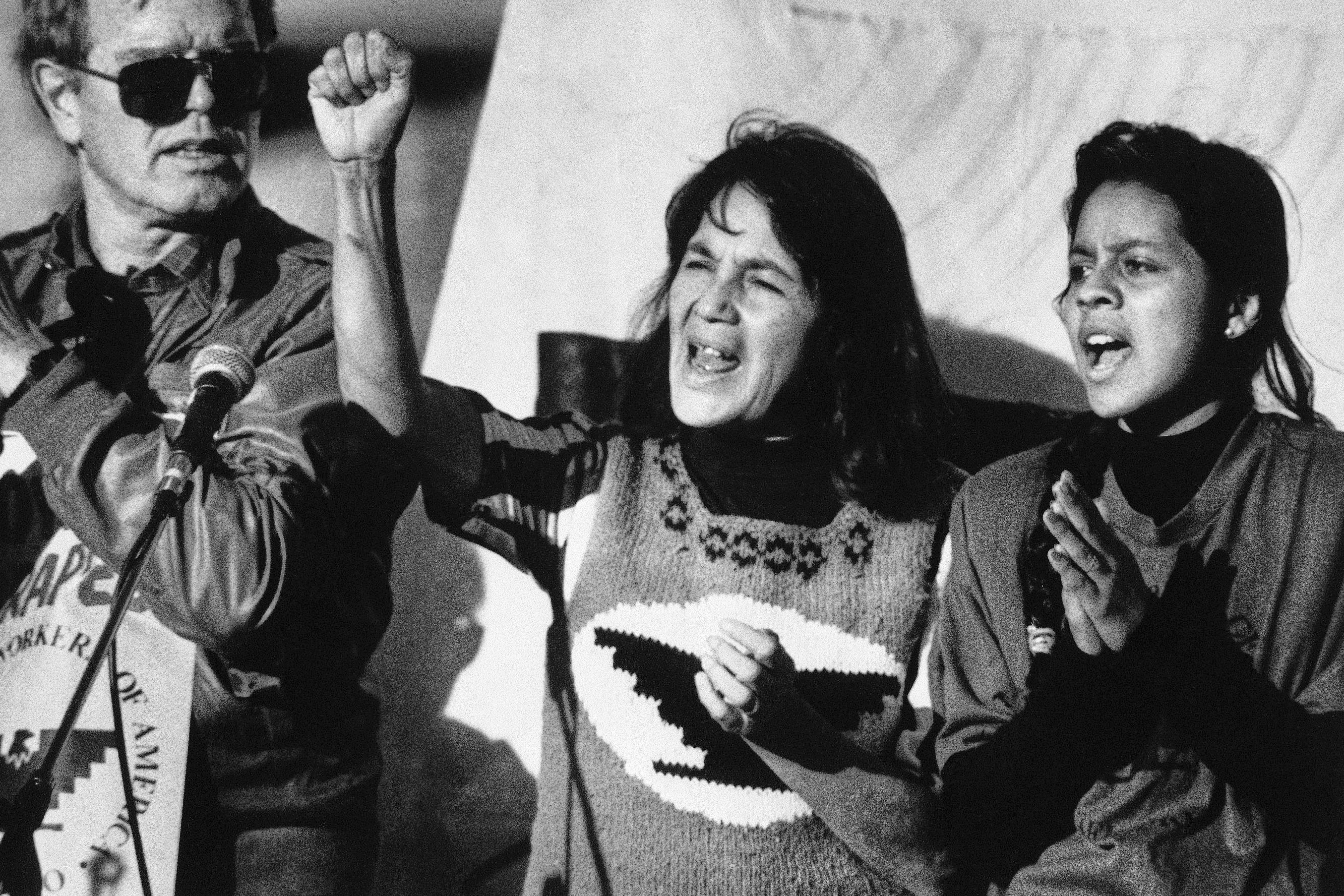 United Farm Workers leader Dolores Huerta leads a rally in San Francisco's Mission District on Nov. 19, 1988, along with Howard Wallace, president of the San Francisco chapter of the UFW, and Maria Elena Chavez, 16, the daughter of Cesar Chavez. Huerta died on Wednesday at the age of 96.