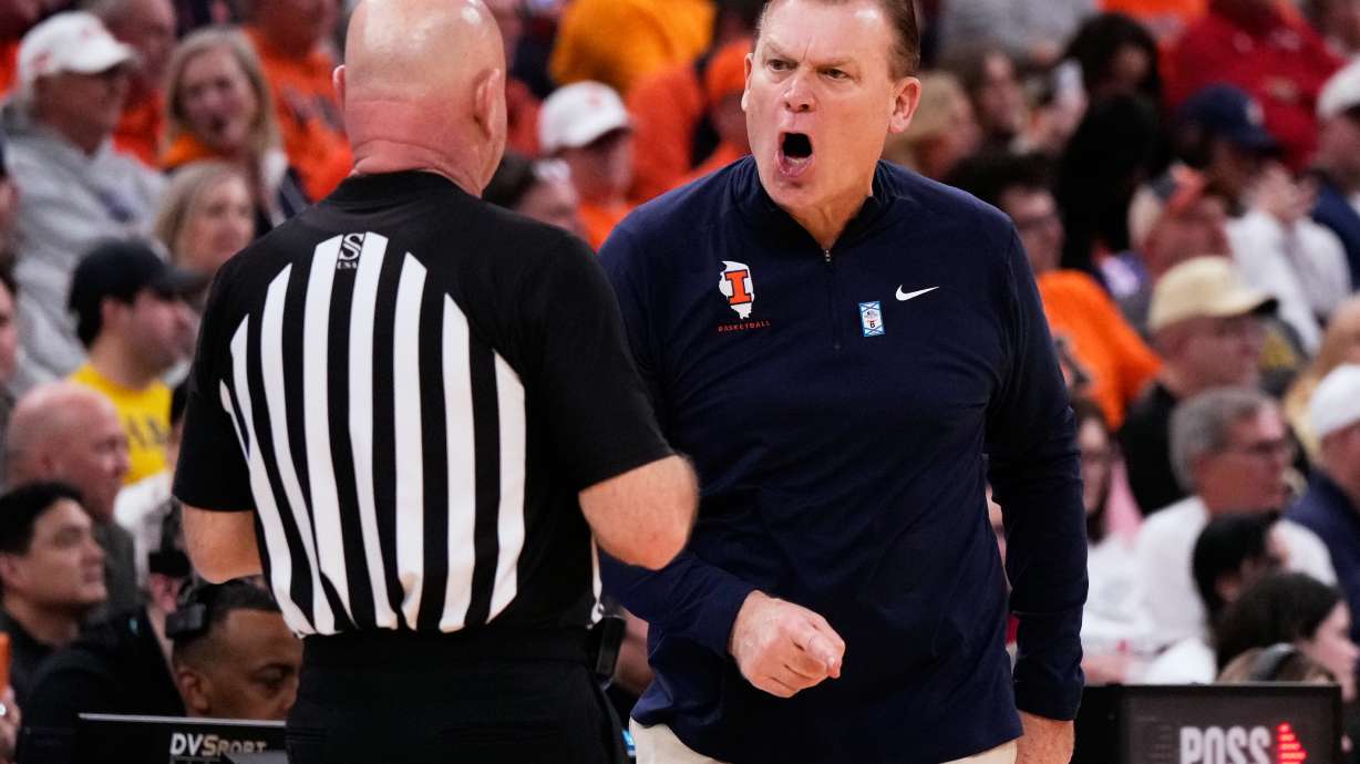 Illinois head coach Brad Underwood, right, reacts to a call during the second half of an NCAA college basketball game against Wisconsin in the quarterfinals of the Big 10 Conference tournament, Friday, March 13, 2026, in Chicago.