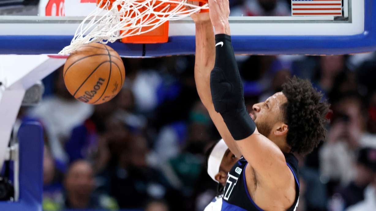 Detroit Pistons guard Cade Cunningham (2) dunks the ball against the Memphis Grizzlies during the first half of an NBA basketball game Friday, March 13, 2026, in Detroit.