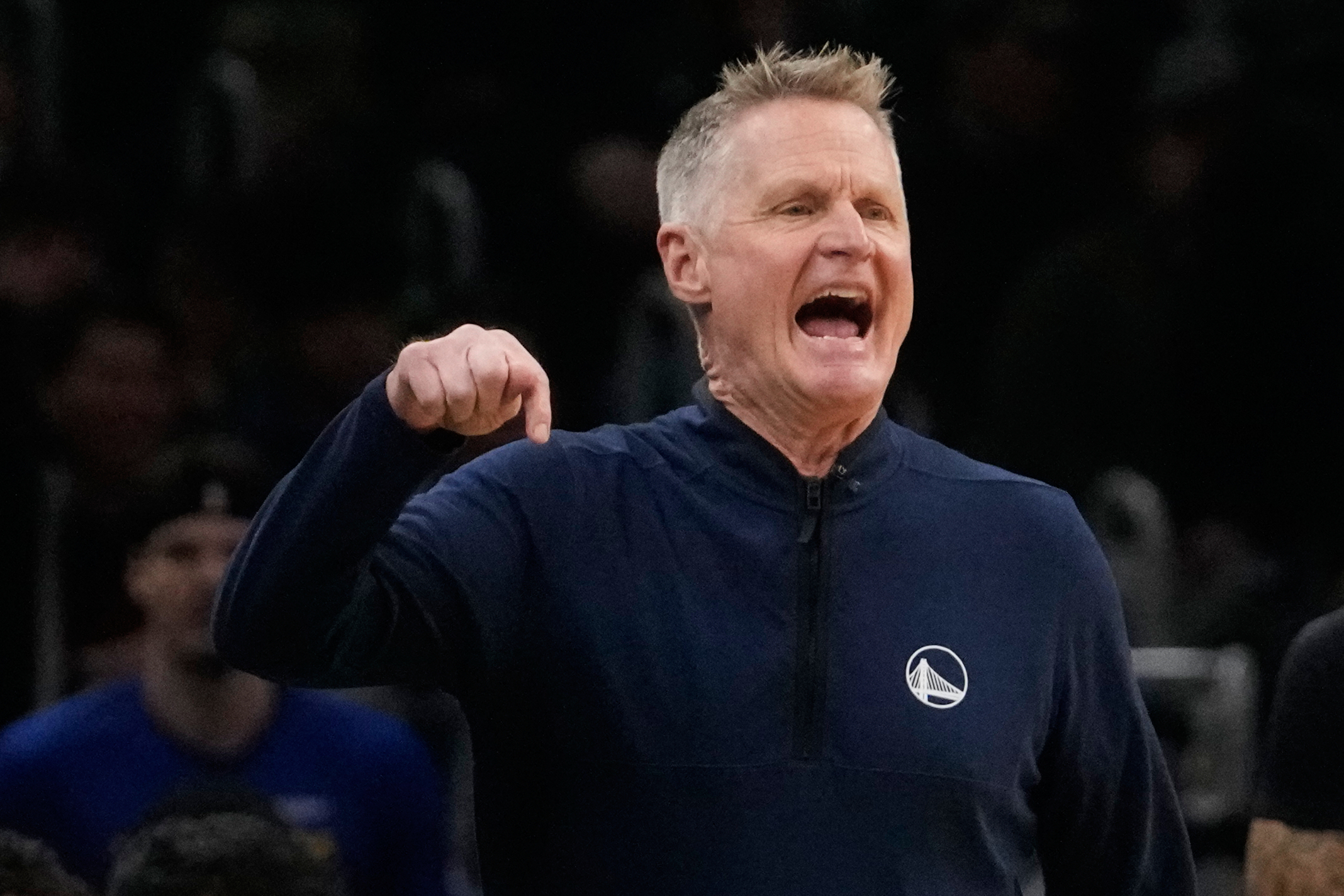 Golden State Warriors head coach Steve Kerr calls to his players during the first half of an NBA basketball game against the Boston Celtics, Wednesday, March 18, 2026, in Boston. 