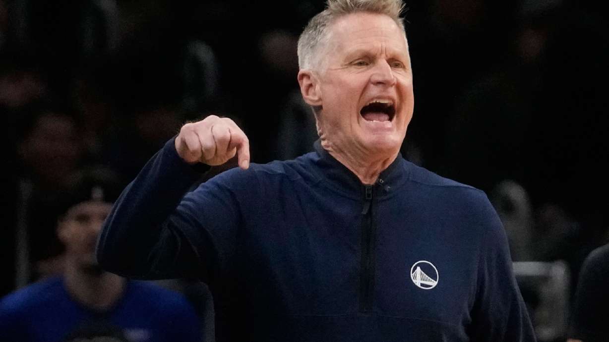Golden State Warriors head coach Steve Kerr calls to his players during the first half of an NBA basketball game against the Boston Celtics, Wednesday, March 18, 2026, in Boston.
