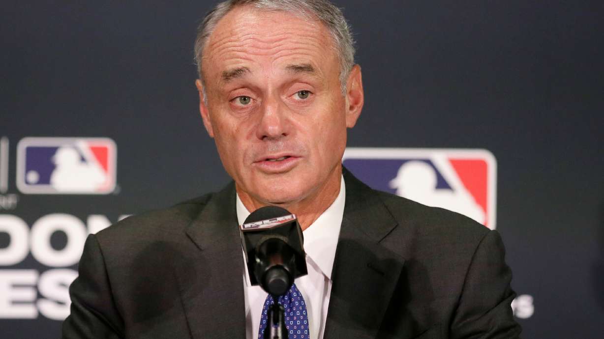 FILE - Major League Baseball commissioner Rob Manfred speaks during a news conference, June 29, 2019, in London.