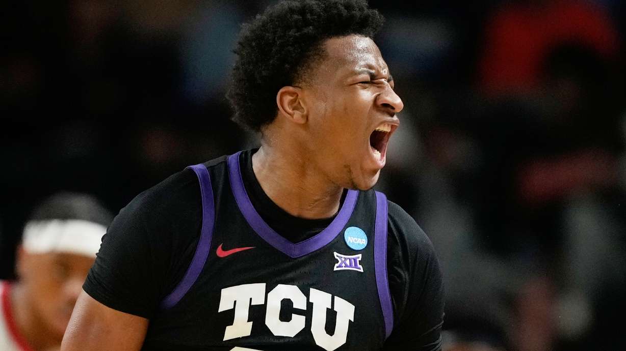TCU forward Xavier Edmonds (24) celebrates scoring during the first half in the first round of the NCAA college basketball tournament against Ohio State, Thursday, March 19, 2026, in Greenville, S.C.