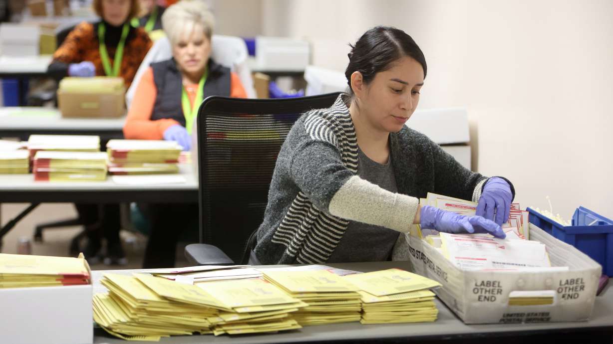 Litzia Galvan, temporary election worker, tabs ballots at the Salt Lake County Government Center in Salt Lake City on Oct. 31, 2024.