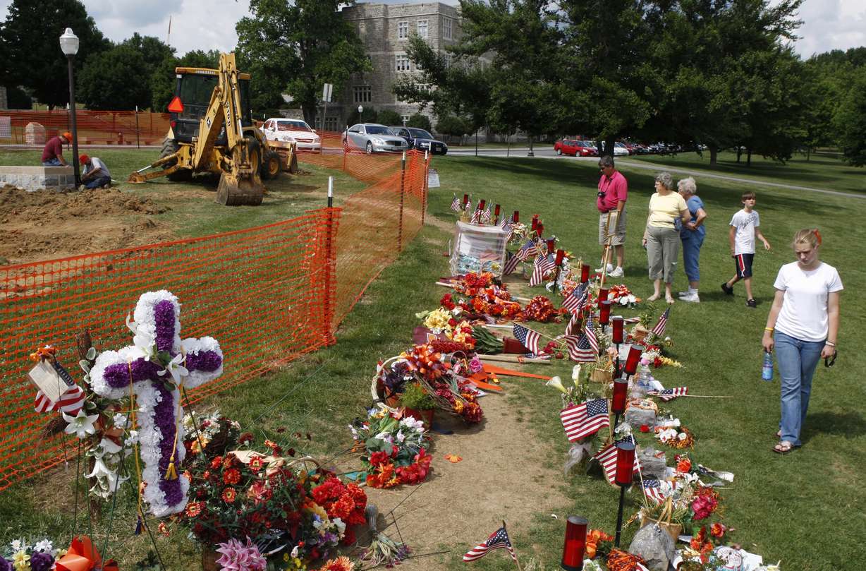 Visitors stop by a makeshift memorial made up of a semi-circle of stones for the Virginia Tech shooting victims on the Drill field of the Virginia Tech campus in Blacksburg, Va., June 13, 2007. A survivor of the shooting spoke at the University of Utah's annual campus safety summit on Thursday.