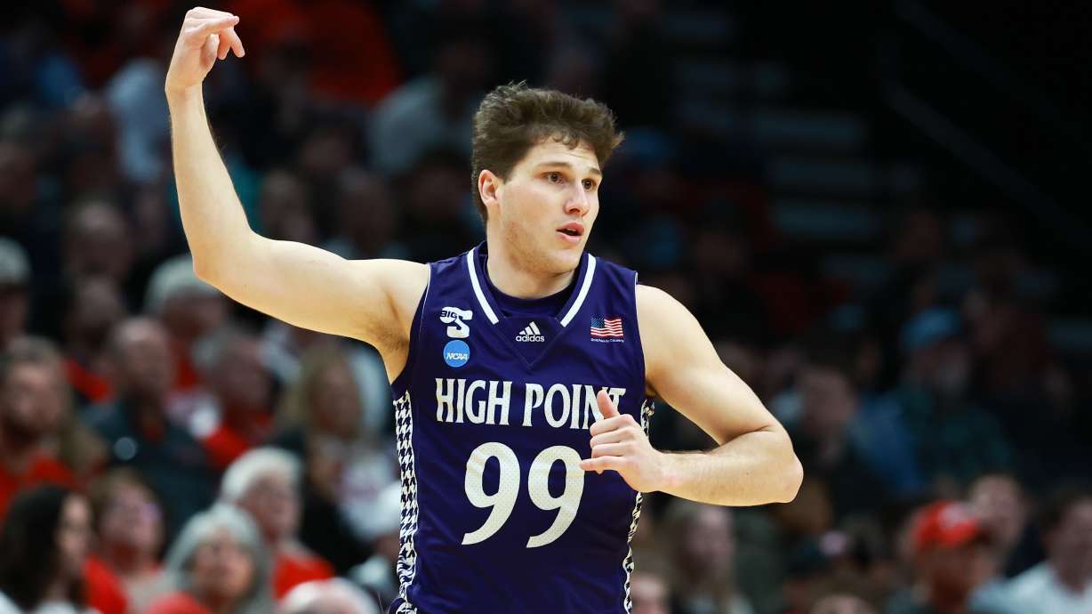 High Point guard Chase Johnston reacts after shooting a 3-pointer during the first half in the first round of the NCAA college basketball tournament against Wisconsin, Thursday, March 19, 2026, in Portland, Ore.