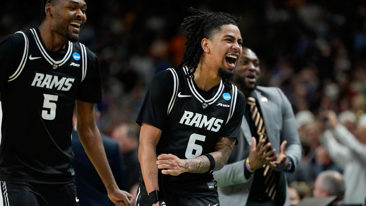 Virginia Commonwealth guard Terrence Hill Jr. (6) and Virginia Commonwealth forward Barry Evans (5) reacts after overtime in the first round of the NCAA college basketball tournament, Thursday, March 19, 2026, in Greenville, S.C.