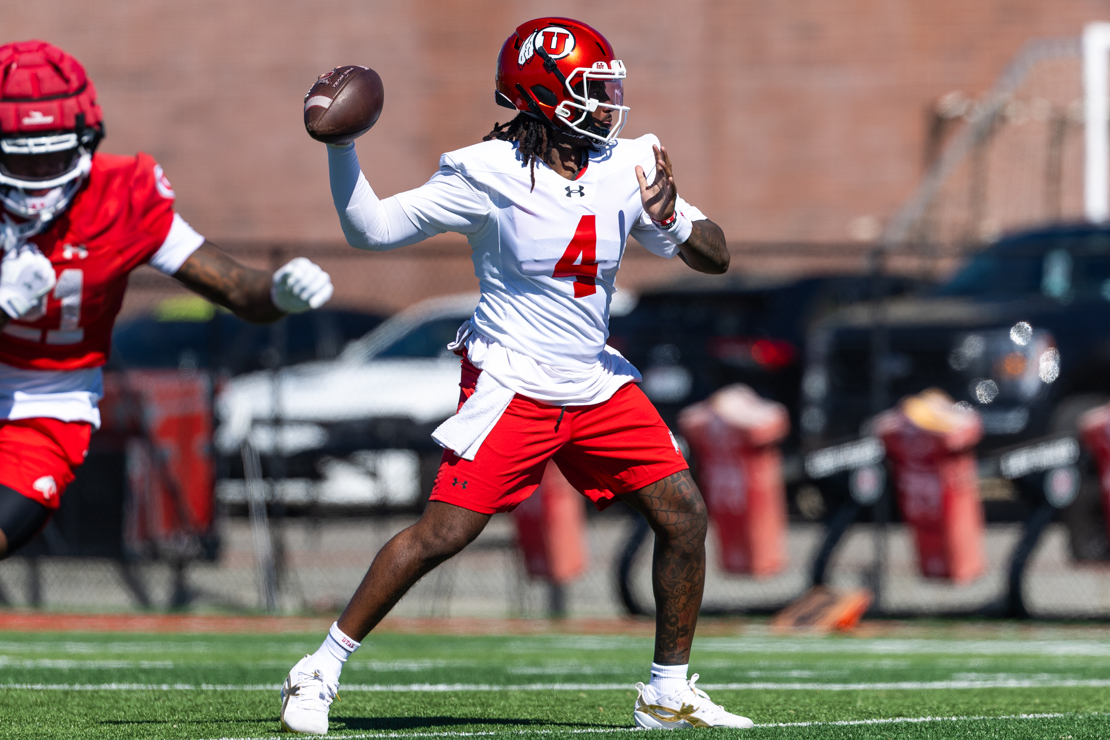 Utah quarterback Devon Dampier prepares to throw during a football spring practice in Salt Lake City on March 19, 2026.