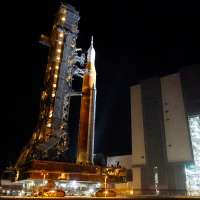 NASA hauls repaired moon rocket from hangar back to pad for early April launch