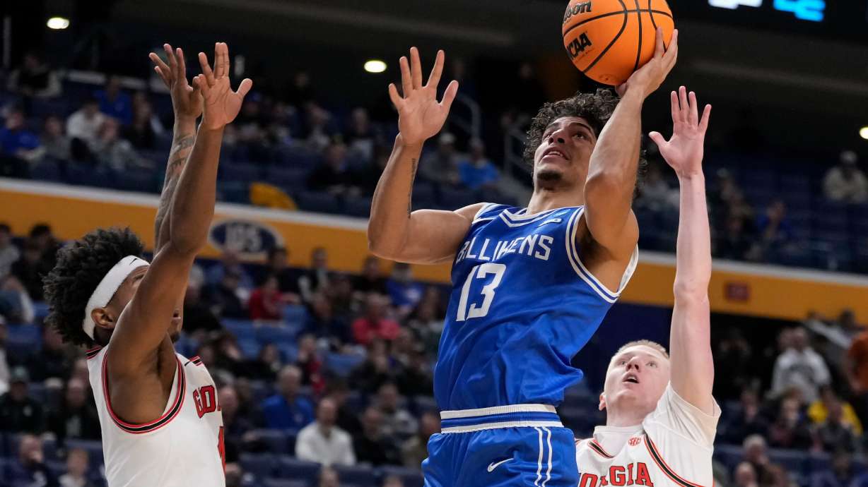 Saint Louis guard Dion Brown (13) shoots over Georgia guard Blue Cain (0) during the second half in the first round of the NCAA college basketball tournament, Thursday, March 19, 2026, in Buffalo, N.Y.