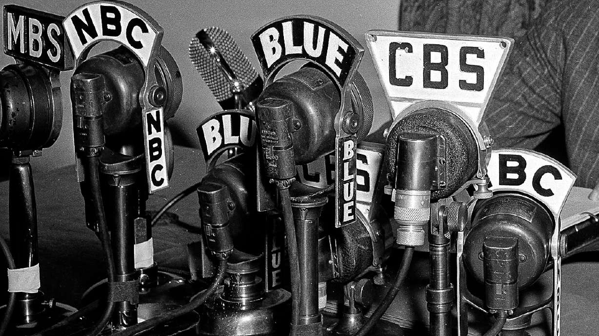 Network microphones on the desk as President Franklin D. Roosevelt addresses the nation from the White House in Washington on April 28, 1942.