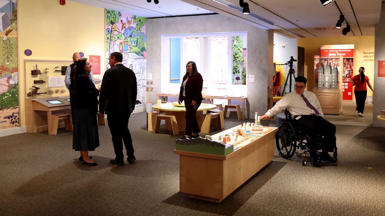 Media representatives tour the “A Firm Foundation” exhibit at the Church History Museum in Salt Lake City on Thursday.