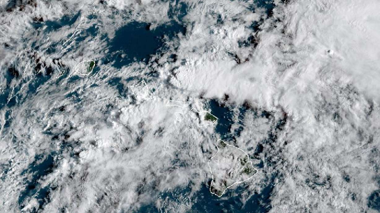 This satellite image provided by the National Oceanic and Atmospheric Administration shows cloud cover over Hawaii on Friday at 12 p.m. MDT. Hawaii officials have ordered evacuations as they warn of the failure of the Wahiawa dam.