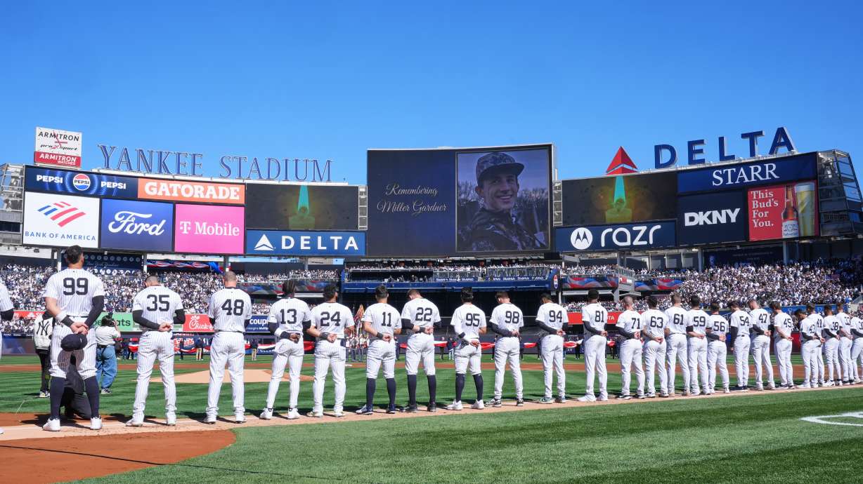 FILE - A moment of silence is observed for Miller Gardner, son of former New York Yankees player Brett Gardner, before the start of an opening-day baseball game between the Yankees and the Milwaukee Brewers at Yankee Stadium, March 27, 2025, in New York.
