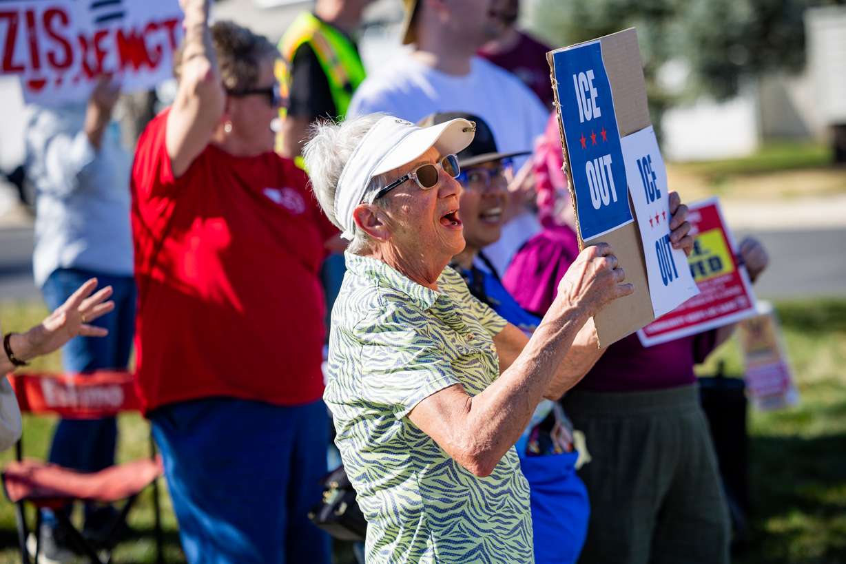 People protest to call attention to what they say are ICE's violations of the city conditional use permit to operate at an office in Ogden on Friday. City officials say they've identified no violations.