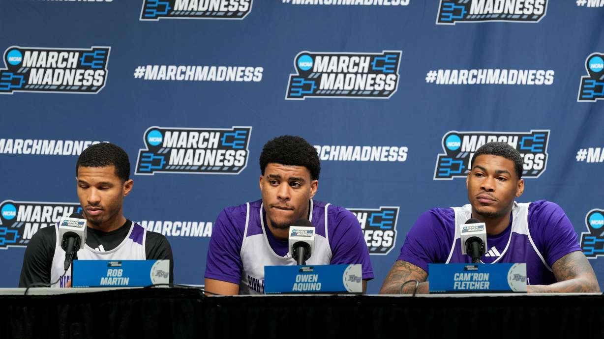 From left to right, High Point guard Rob Martin, forward Owen Aquino and forward Cam'ron Fletcher listen during a news conference prior to the second round of the NCAA college basketball tournament Friday, March 20, 2026, in Portland, Ore.