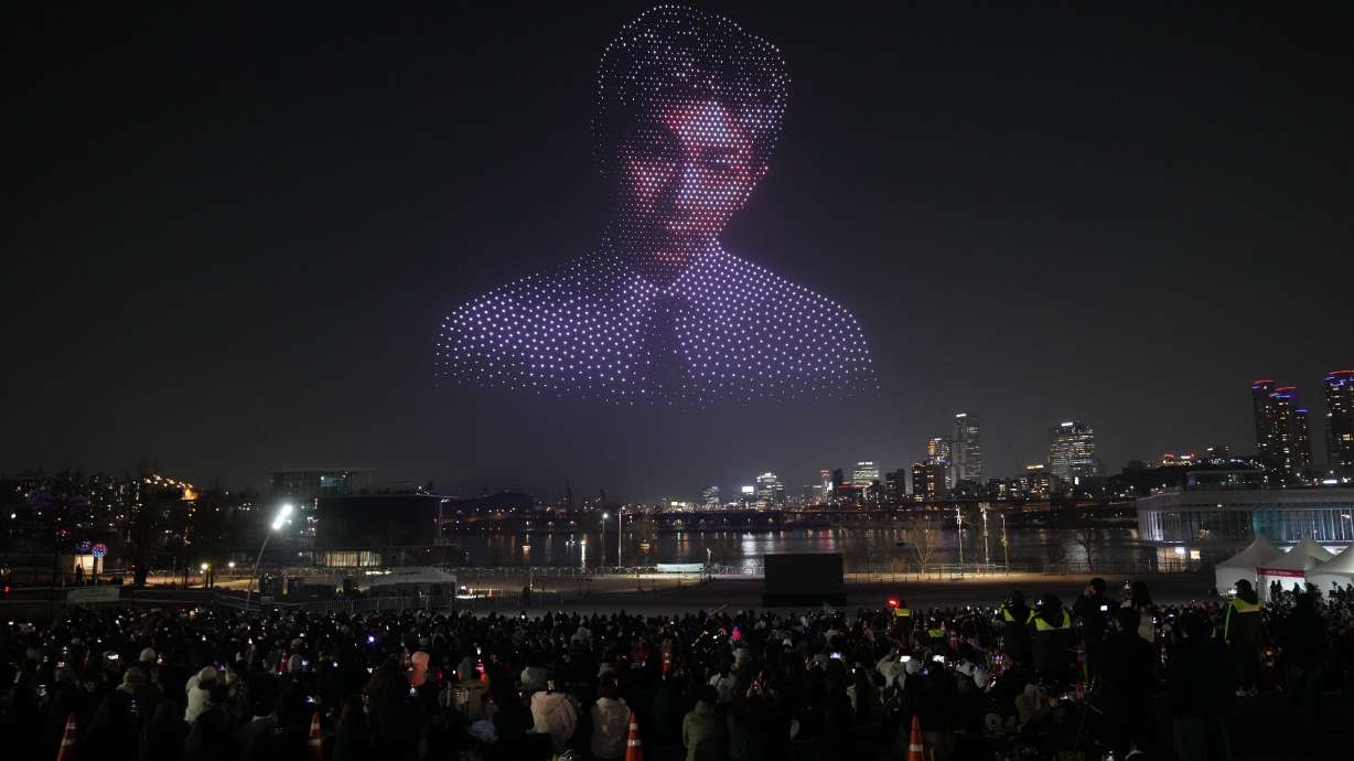 Drones fly in the shape of the K-pop band BTS's member RM during a drone light show to celebrate the comeback of the K-pop band BTS at a park along the Han River in Seoul, South Korea, Friday.