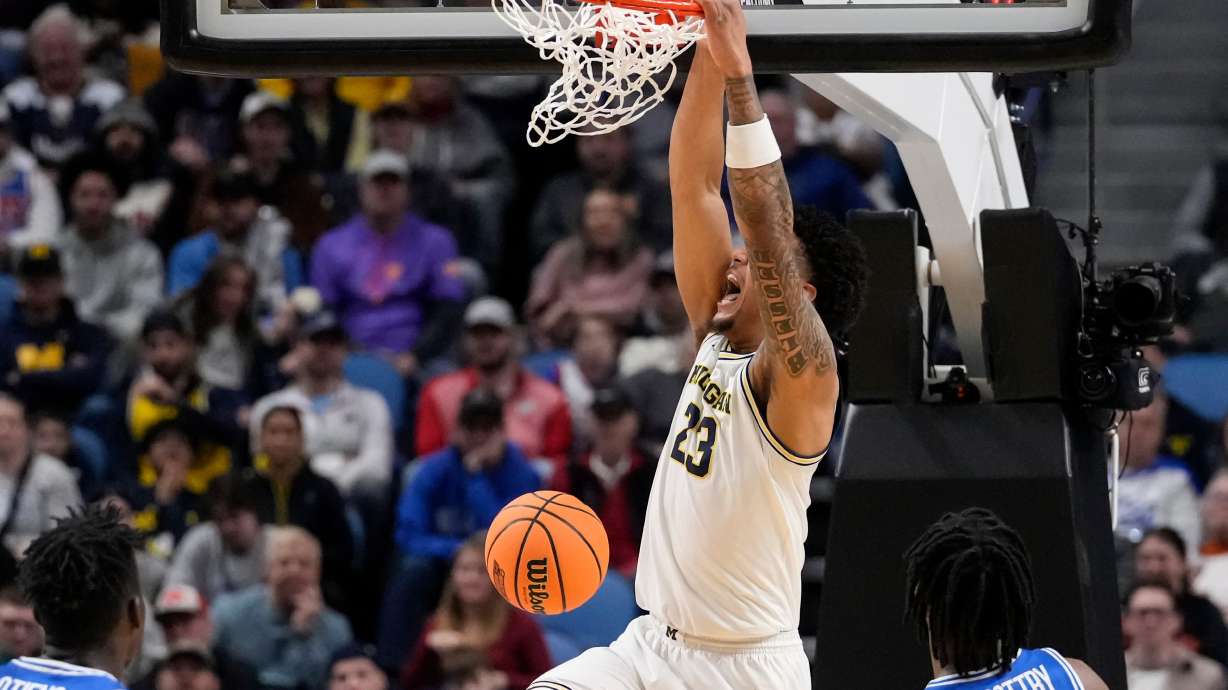 Michigan forward Yaxel Lendeborg (23) dunks against Saint Louis during the first half in the second round of the NCAA college basketball tournament, Saturday, March 21, 2026, in Buffalo, N.Y.