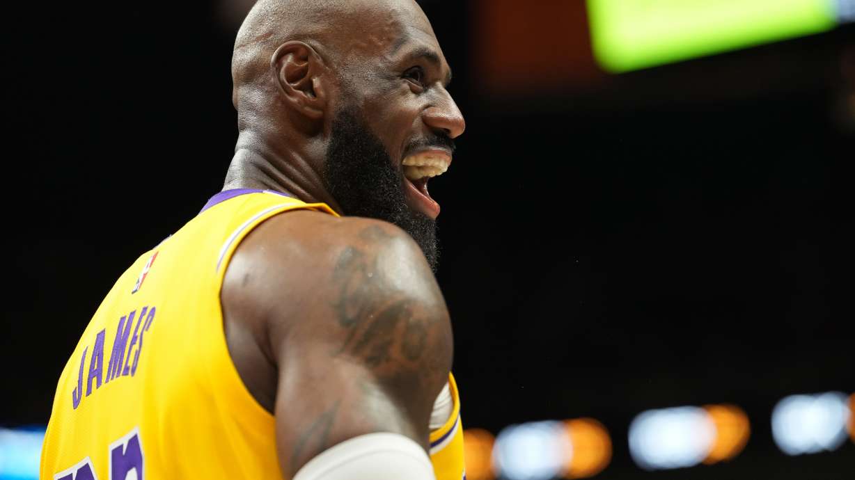 Los Angeles Lakers forward LeBron James smiles during the second half of an NBA basketball game against the Miami Heat, Thursday, March 19, 2026, in Miami.