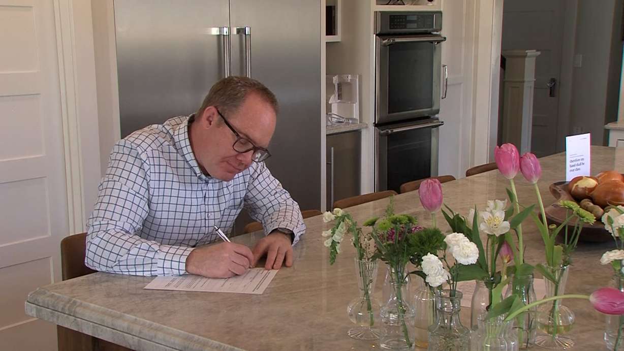 Stanton Allen fills out a form to request his signature be removed from the petition to repeal Prop 4.