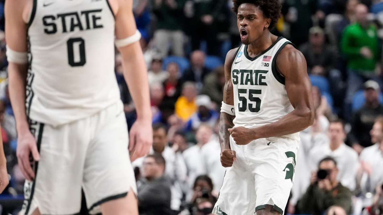 Michigan State forward Coen Carr (55) reacts after dunking against Louisville during the second half in the second round of the NCAA college basketball tournament, Saturday, March 21, 2026, in Buffalo, N.Y.