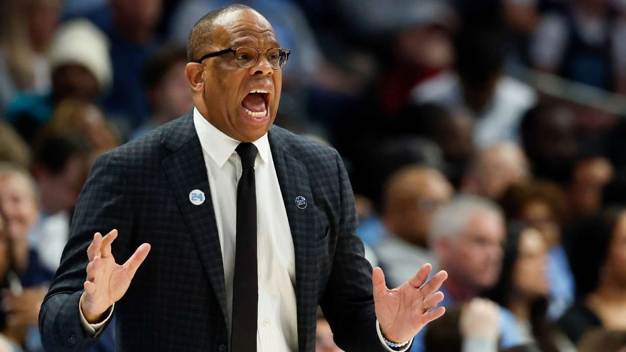 North Carolina head coach Hubert Davis directs his team during the first half of an NCAA college basketball game against Clemson in the quarterfinals of the Atlantic Coast Conference tournament in Charlotte, N.C., Thursday, March 12, 2026.