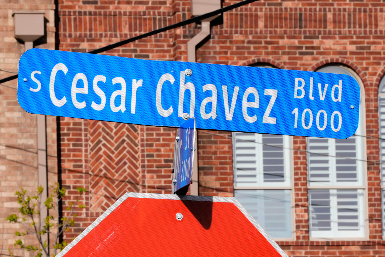 A Cesar Chavez street sign is shown near the Dallas Farmers Market in Dallas, Wednesday. Many states are reconsidering how they honor Chavez following revelations of alleged sexual abuse.
