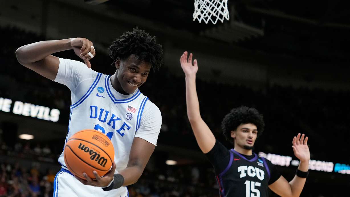 Duke center Patrick Ngongba (21) reacts after he releases the ball during the first half in the second round of the NCAA college basketball tournament against TCU, Saturday, March 21, 2026, in Greenville, S.C.