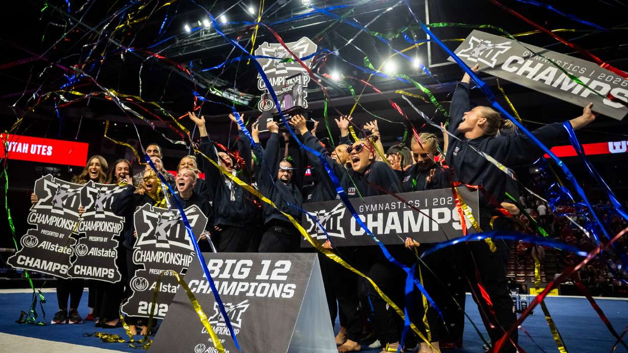 The Red Rocks celebrate after winning the Big 12 gymnastics championships at the Maverik Center in West Valley City on Saturday, March 21, 2026.