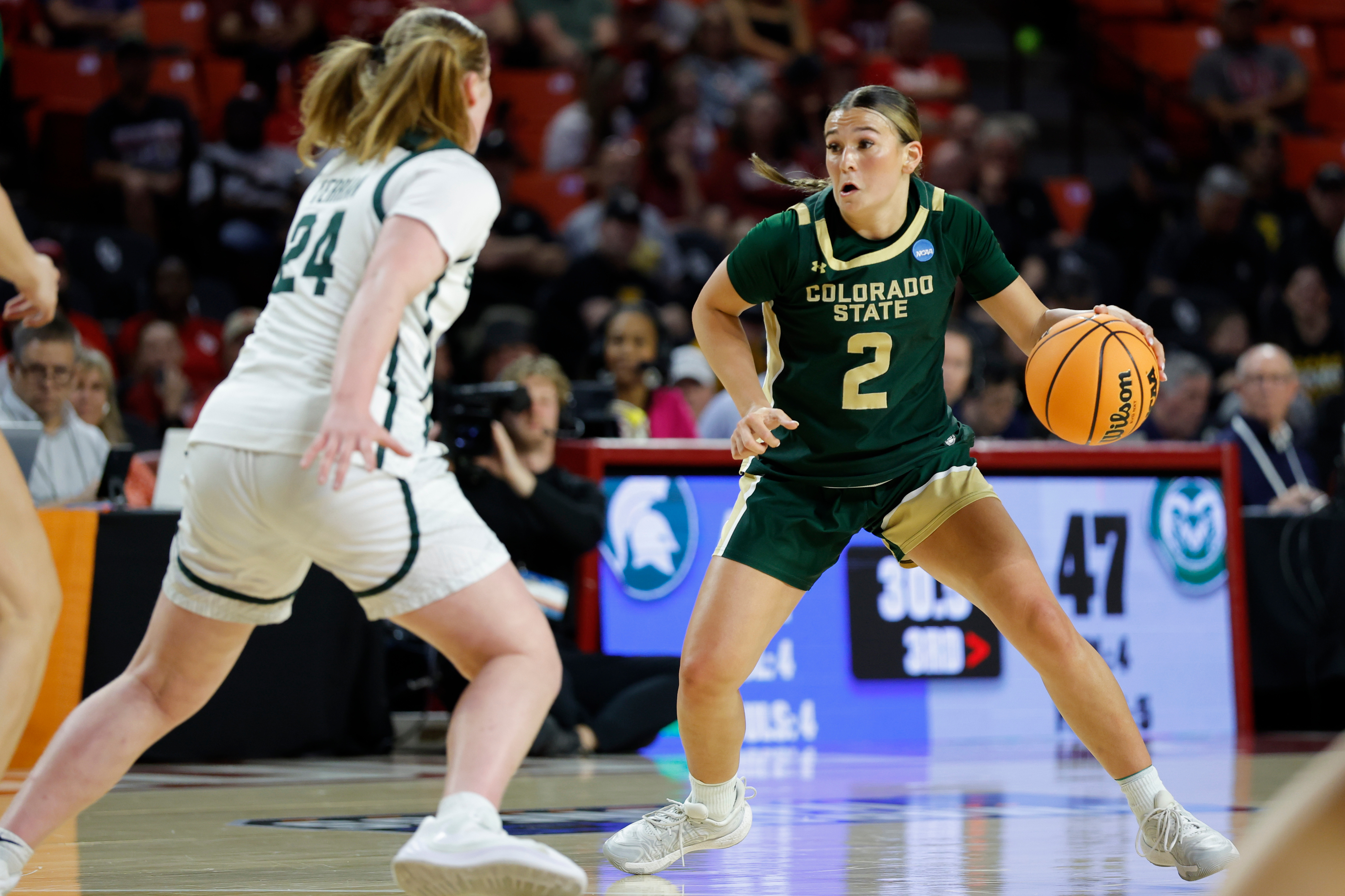 Colorado State guard Brooke Carlson (2) moves the ball down the court against Michigan State guard Amy Terrian (24) during the second half in the first round of the NCAA college basketball tournament Friday, March 20, 2026, Norman, Okla. 