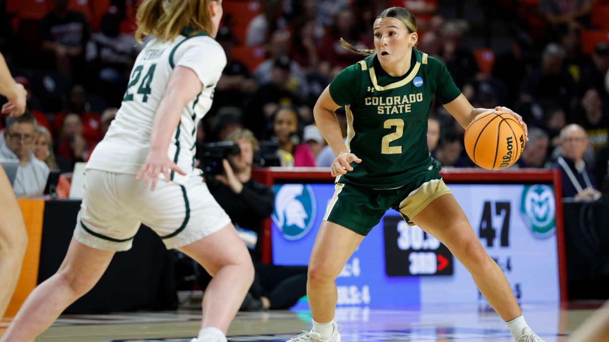 Colorado State guard Brooke Carlson (2) moves the ball down the court against Michigan State guard Amy Terrian (24) during the second half in the first round of the NCAA college basketball tournament Friday, March 20, 2026, Norman, Okla.