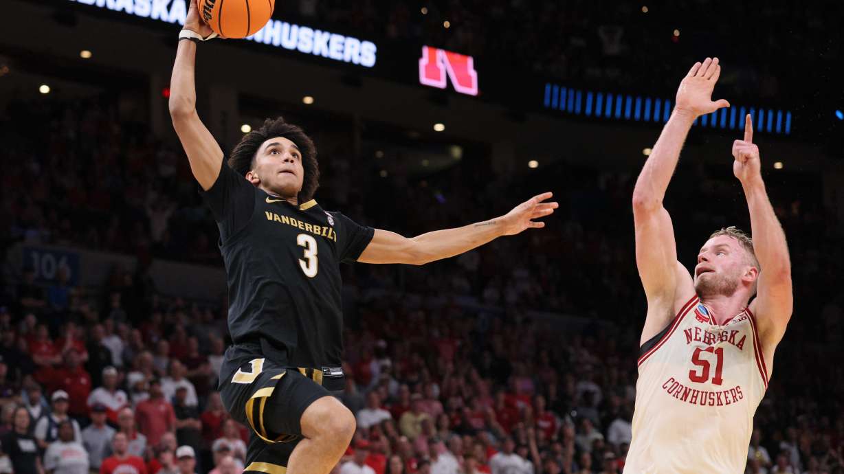 Vanderbilt guard Tyler Tanner (3) goes to the basket against Nebraska forward Rienk Mast (51) during the first half in the second round of the NCAA college basketball tournament, Saturday, March 21, 2026, in Oklahoma City.