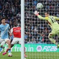 Man City dominates Arsenal to win English League Cup and make statement in Premier League title race