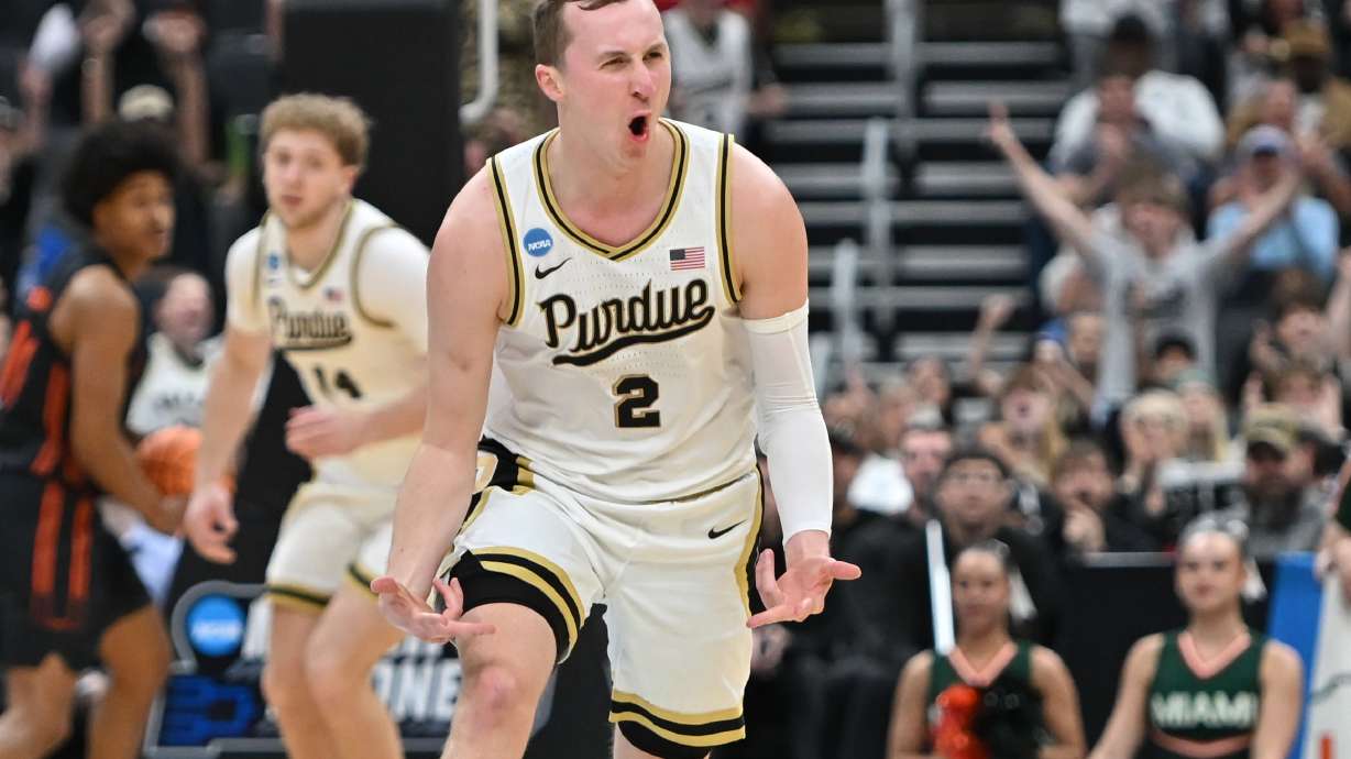 Purdue's Fletcher Loyer (2) celebrates during the first half in the second round of the NCAA college basketball tournament against Miami, Sunday, March 22, 2026, in St. Louis.
