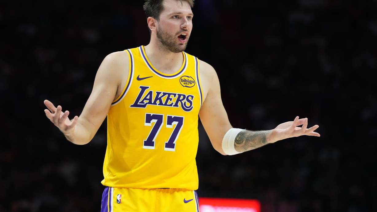 Los Angeles Lakers guard Luka Doncic (77) argues a call during the second half of an NBA basketball game against the Miami Heat, Thursday, March 19, 2026, in Miami.